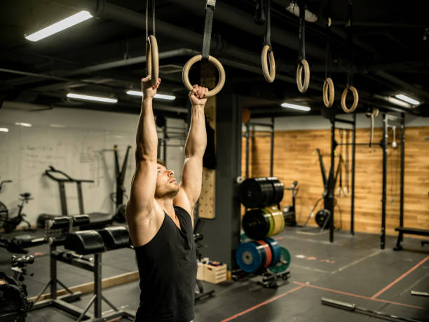istock Man exercising in the Gym 1352520761