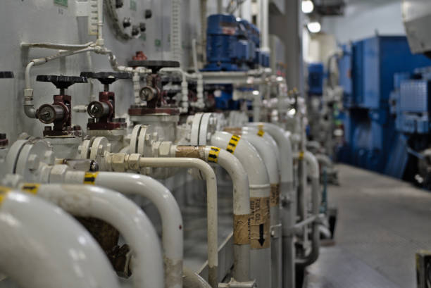 istock Industrial valves, pipes in modern offshore ship's engine room 1352521735