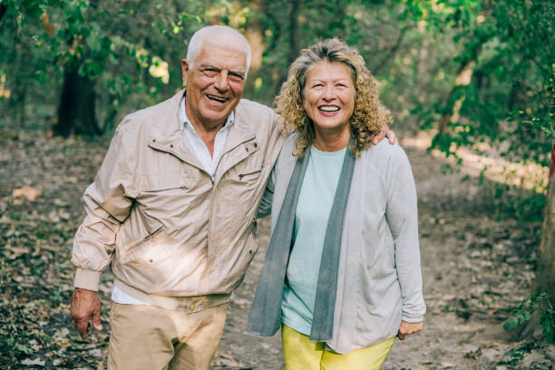 istock Senior couple walking in a forest. 1352524793