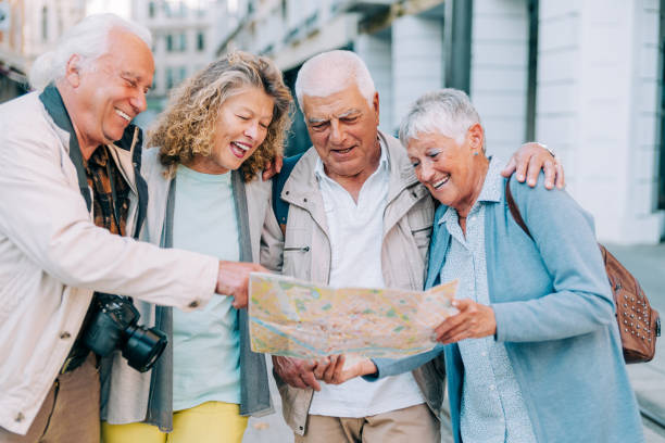 istock Cheerful senior tourists exploring foreign city using a map. 1352524806