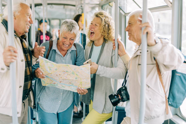 istock Cheerful senior tourists exploring foreign city using a map. 1352526071