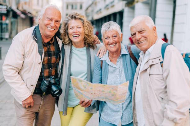 istock Cheerful senior tourists exploring foreign city using a map. 1352526100
