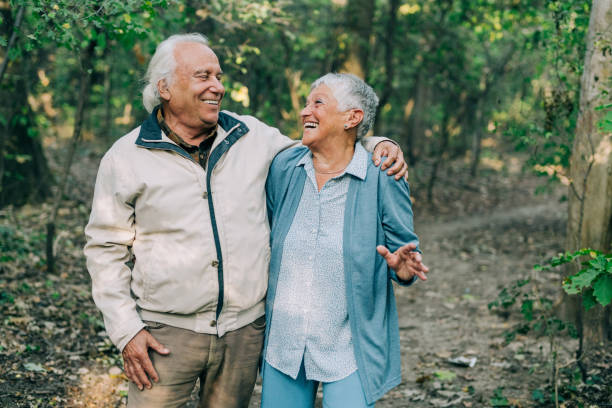 istock Senior couple walking in a forest. 1352526128