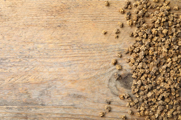 istock Raw beet seeds and space for text on wooden background, flat lay. Vegetable planting 1352531589
