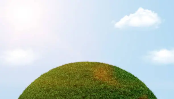 Photo of Part of a spherical Green Grass Clouds and blue sky 3d illustration