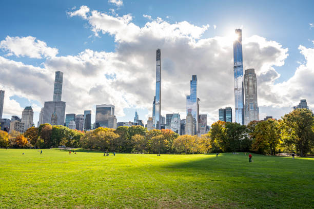 istock autumn central park and buildings 1352537120