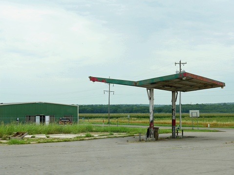Dilapidated, old gasoline station by the roadside in Oklahoma