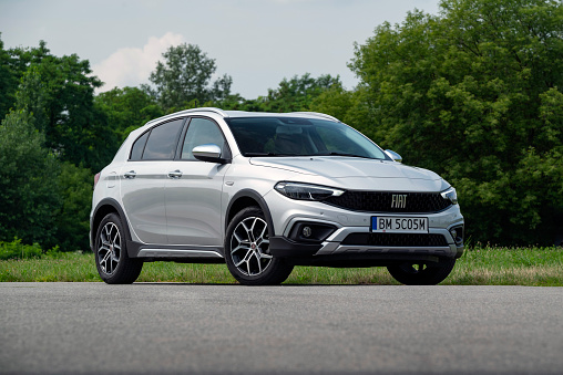 Berlin, Germany - 17th July, 2021: Fiat Tipo Cross parked on a road. This compact car is one of the cheapest vehicles in C-segment in Europe.