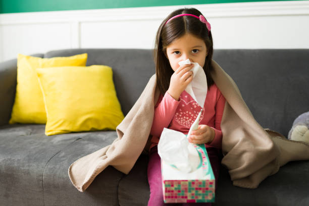 istock Sick kid feeling cold and sick in the winter 1352550706