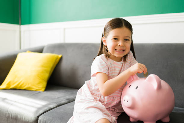 istock Kid saving to buy toys and presents 1352551026