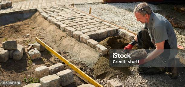 Granite Cobble Path Construction Stock Photo - Download Image Now - Landscaped, Paving Stone, Working