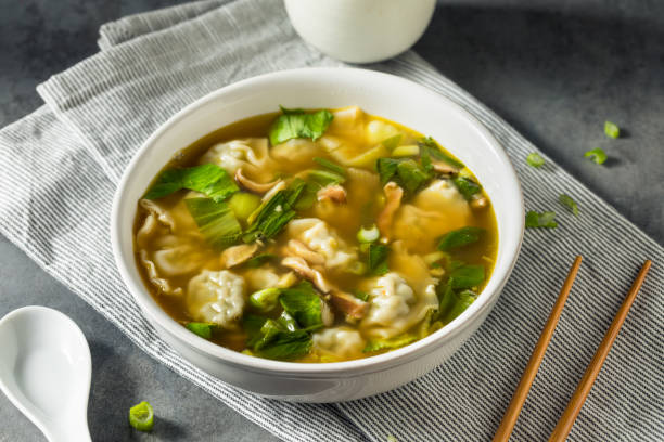 Homemade Asian Chicken Wonton Soup Homemade Asian Chicken Wonton Soup with Bok Choy Wonton Soup stock pictures, royalty-free photos & images