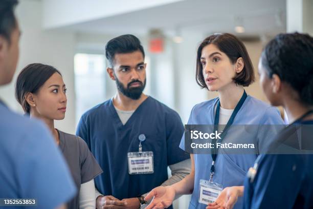 Medical Professional Team Meeting Stock Photo - Download Image Now - Nurse, Healthcare And Medicine, Meeting