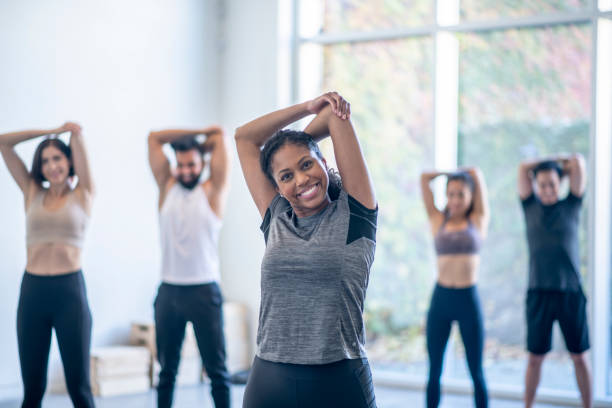 istock Arm Stretches During Fitness Class 1352553938