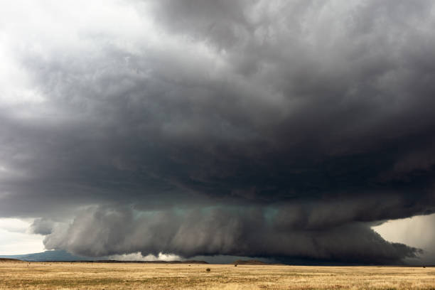 istock Stormy sky with dark, ominous clouds 1352554624