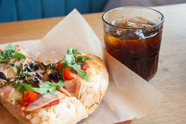 istock Delicious Italian pizza with cola soda with ice 1352556064