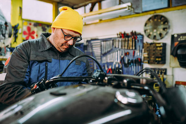 istock A mechanic repairs the bike 1352556192