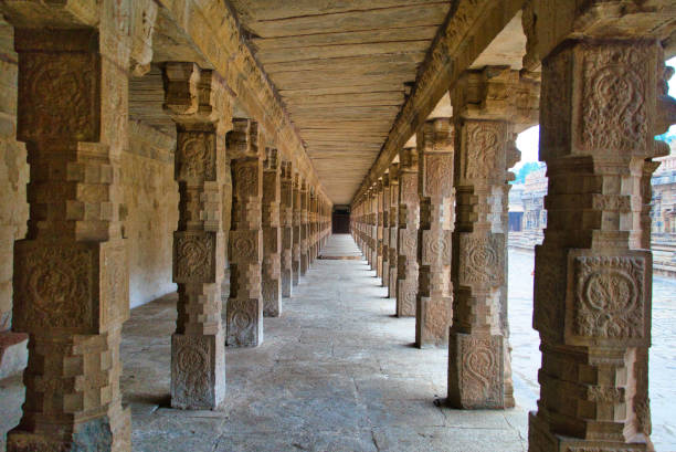 istock Ancient and simple carved stone pillars. Airavateswara temple. 1352569110