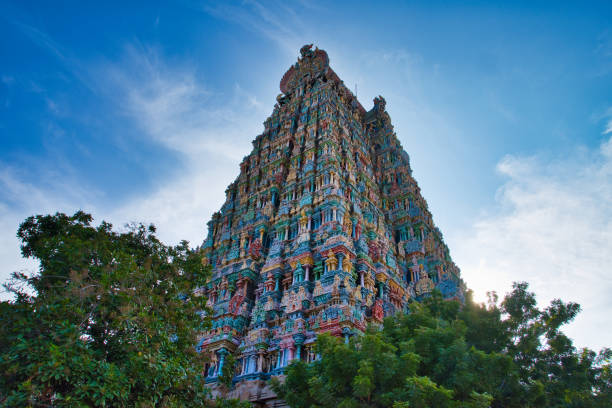 The colorful exterior of the temple of Meenakshi. The colorful exterior of the temple of Meenakshi. One of the ancient temples in Madurai , Tamil Nadu, India. menakshi stock pictures, royalty-free photos & images