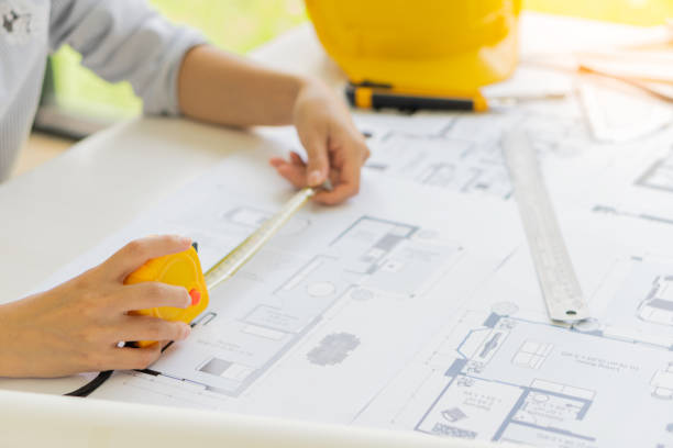 istock Engineers, designers, drawings, engineering, industrial plants, blueprints, measuring projects, caliper tools creative architect in the office 1352570322