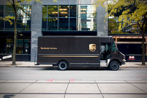 Toronto, Ontario, Canada, - November, 10 2021: A parked UPS truck in downtown Toronto.
