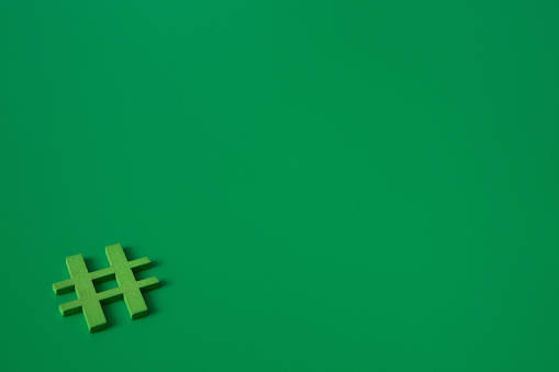 Green wooden symbol Hashtag 