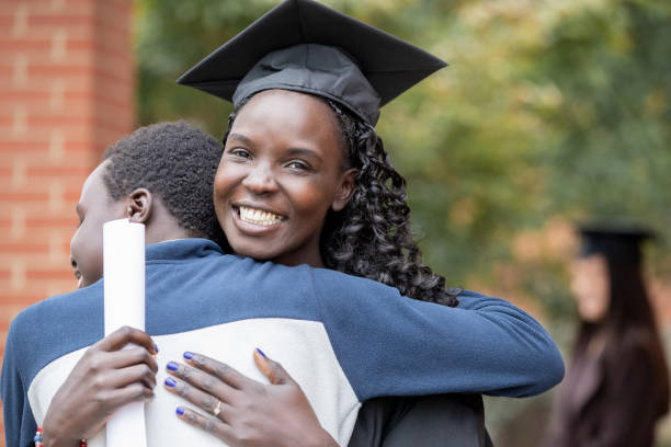 istock Mother hugging Son after Graduation ceremony 1352575986