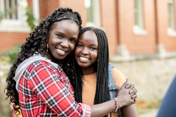 istock Proud Mother dropping daughter off at School 1352579845