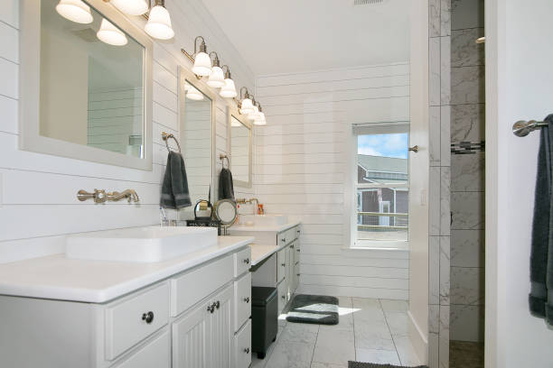 istock All white tile, shiplap walls and vanities in bathroom 1352582998