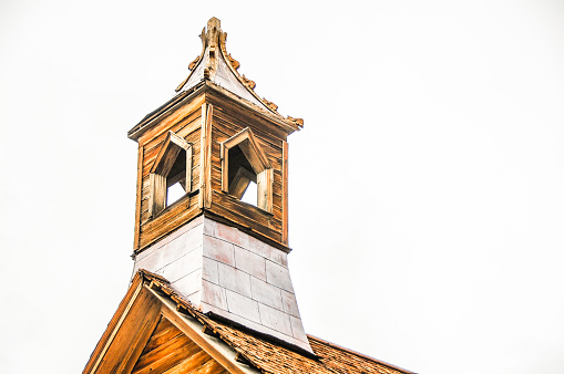 Traditional wooden church in the mountain valley. Picturesque landscape in Carpathian mountains.