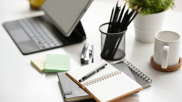 istock Simple office workspace with digital tablet, note books and stationery 1352583671
