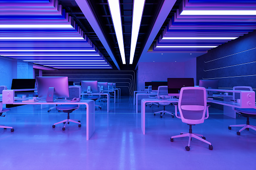 Empty Open Plan Office At Night With Neon Lights