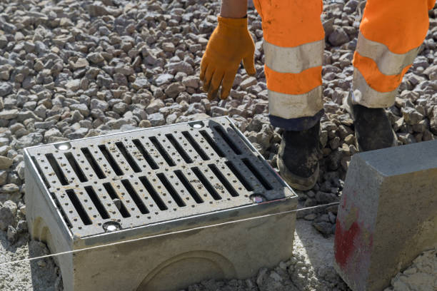 istock Grate on well a concrete base during the laying water drainage construction 1352595555