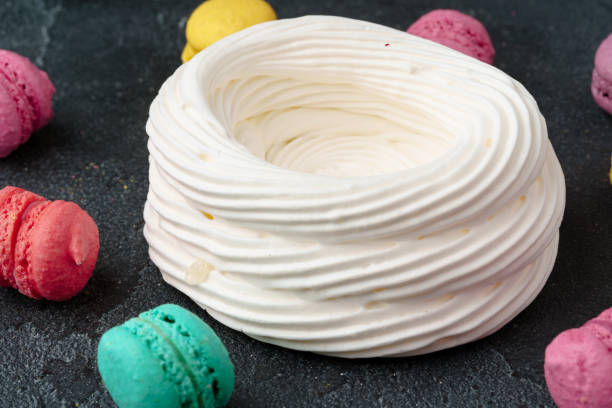 istock Whipped cream Meringue dessert on black background 1352600257