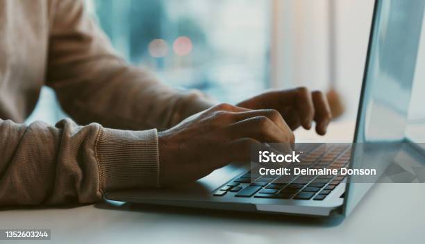 Shot Of An Unrecognizable Businessman Working On His Laptop In The Office Stock Photo - Download Image Now