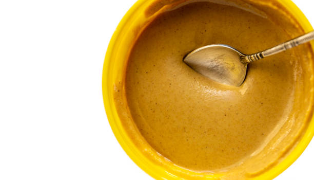senape servita in una ciotola foto ravvicinata - mustard sauce foto e immagini stock