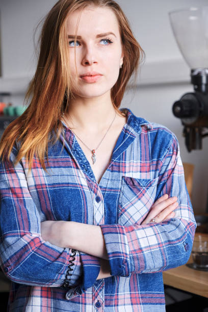 istock Serious woman with hands crossed on chest 1352604554