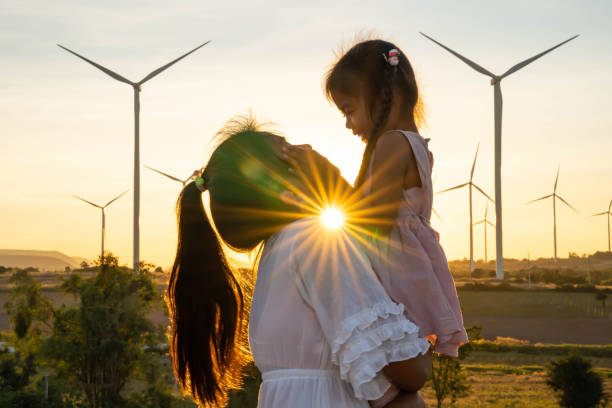 Wind turbines are alternative electricity sources, the concept of sustainable resources, People in the community with wind generators turbines, Renewable energy Wind turbines are alternative electricity sources, the concept of sustainable resources, People in the community with wind generators turbines, Renewable energy. landscape alternative energy scenics farm stock pictures, royalty-free photos & images