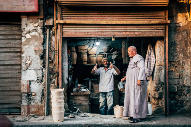 cairo, egypt. 8th october, 2021: a local carpenter is posing to the camerain in cairo street