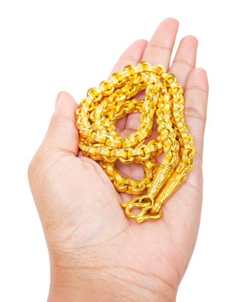istock Gold bracelet on hand isolated on white background 1352610532