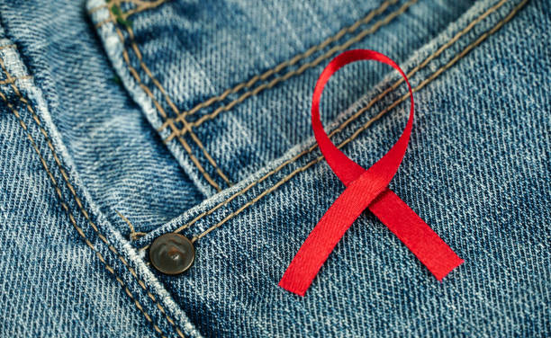 istock jeans with red ribbon, World Aids Day 1352613791