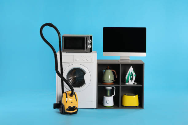 istock Set of different home appliances with vacuum cleaner on light blue background 1352617059