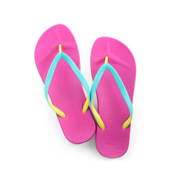 istock Pair of stylish pink flip flops isolated on white, top view. Beach object 1352617654