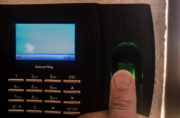 istock Employee doing check in on  fingerprint attendance machine 1352619613