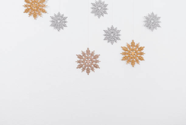 istock Snowflakes simple christmas decoration on white background. 1352620814