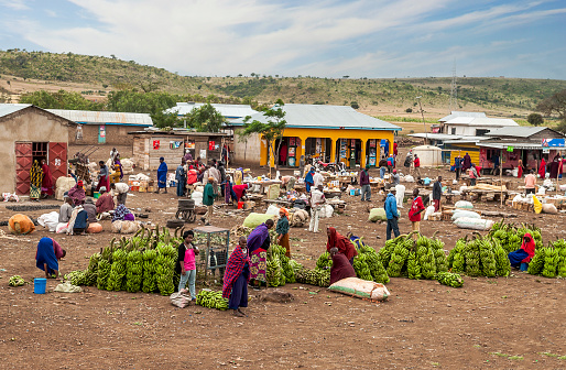 ARUSHA, TANZANIA - OCTOBER 21, 2014 : Typical street scene in Arusha. Arusha is located below Mount Meru in the eastern branch of the Great Rift Valley and the capital of the Arusha Region.