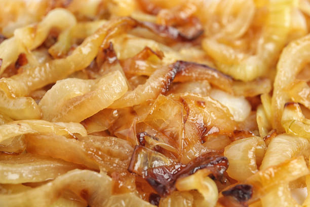 Tasty fried onion as background, closeup view