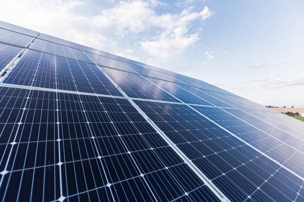 istock Solar panel photo close up on blue sky background, renewable energy eco 1352623261