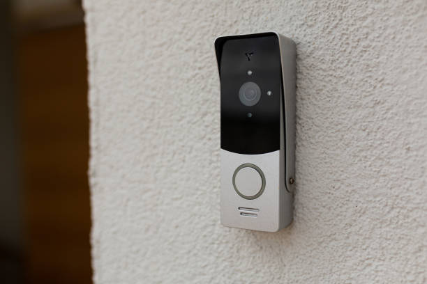 doorbell on the wall of the house with a surveillance camera doorbell on the wall of the house with a surveillance camera doorbell photos stock pictures, royalty-free photos & images