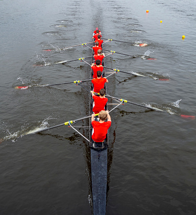 Aerial view of eight man team boat training on the rowing channel the Bosbaan in Amsterdam. The Netherlands.